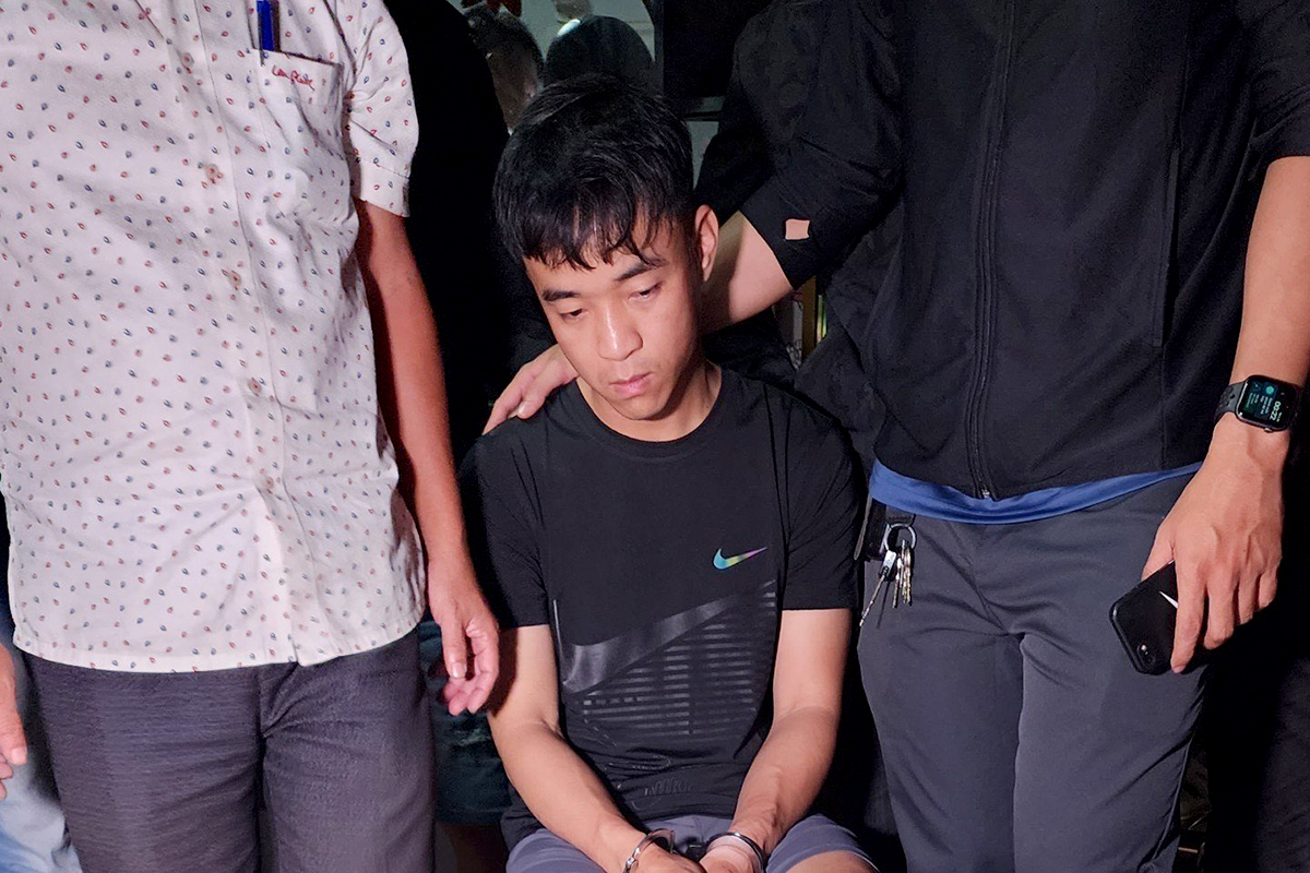 Lê Phú Cao khi bị cảnh sát bắt giữ. Ảnh: Công an cung cấp