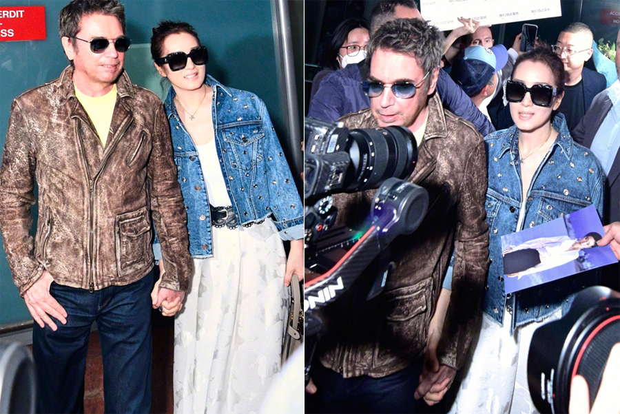 anh-cung-loi-1-1958-1684123710 Vợ chồng Củng Lợi ở sân bay. Ảnh: Sina