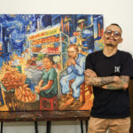 Trần Trung Lĩnh bên bức vẽ cảnh Van Gogh ăn bánh mỳ ở đường Bùi Viện. Ảnh: Nhân vật cung cấp