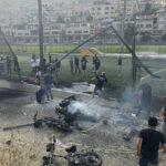 Hiện trường vụ rocket rơi trúng sân bóng tại thị trấn Majdal Shams ngày 27/7. Ảnh: AP