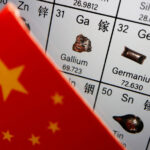Cờ Trung Quốc cạnh các nguyên tố Gallium và Germaniumtrên bảng tuần hoàn. Ảnh:Reuters